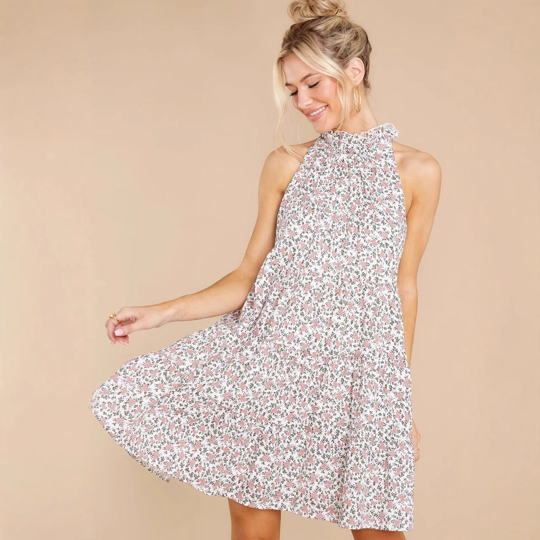Women's halter dress with playful floral design and ruffle details