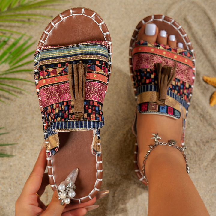 Dame slide-sandaler med farverigt vævdesign og fashionable kvaster Stilla
