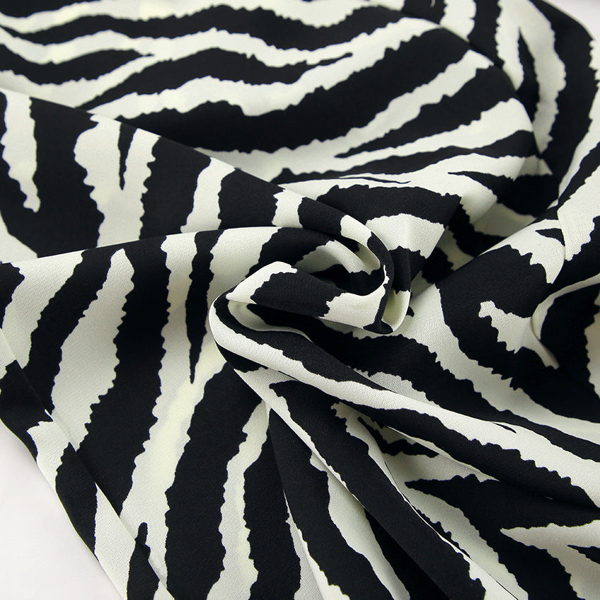 Dame bred Zebra-print Palazzo-bukser med elastisk talje og elegant snit Stilla
