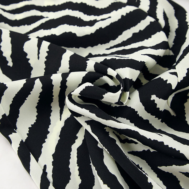 Dame bred Zebra-print Palazzo-bukser med elastisk talje og elegant snit Stilla