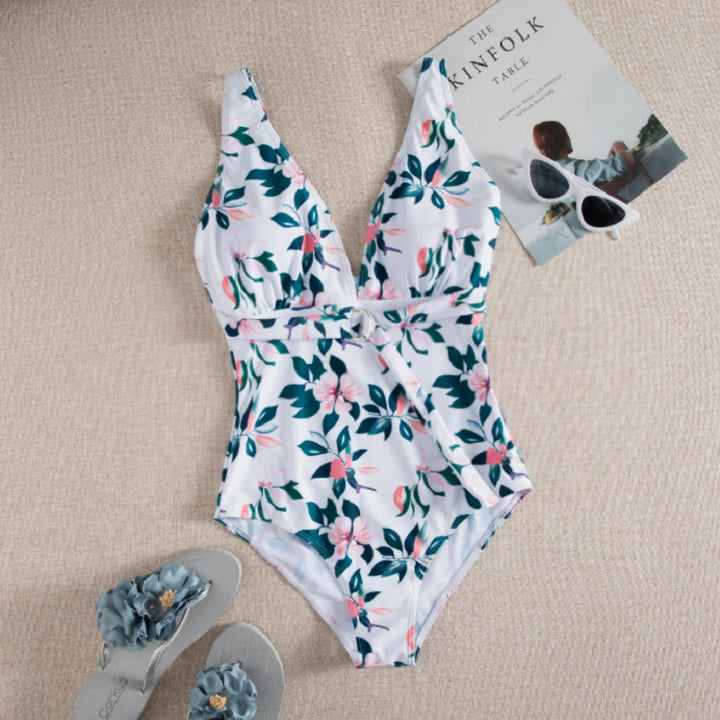 Dame én-delt badedragt med elegant snøre detaljer og floralt design Stilla