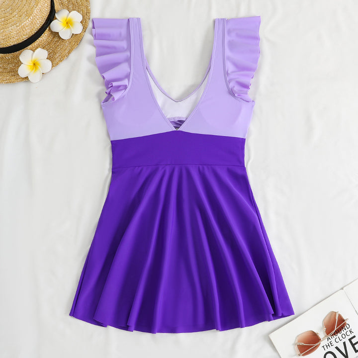Dame one-piece badedragt med feminint indpakningsdesign og cut-out-detaljer Skovae