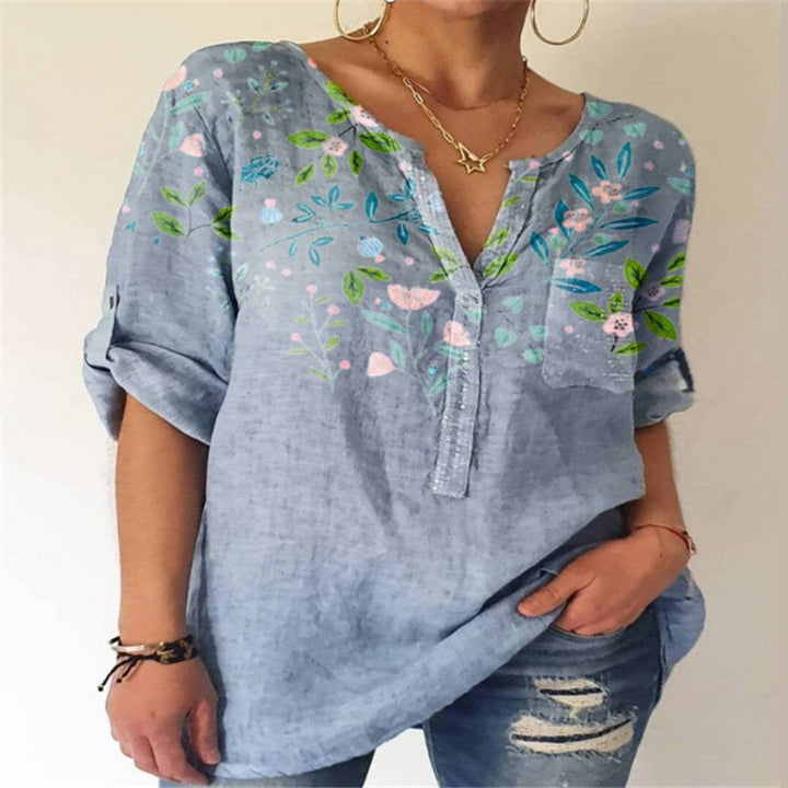 Damebluse med floral broderedesign og V-hals Stilla