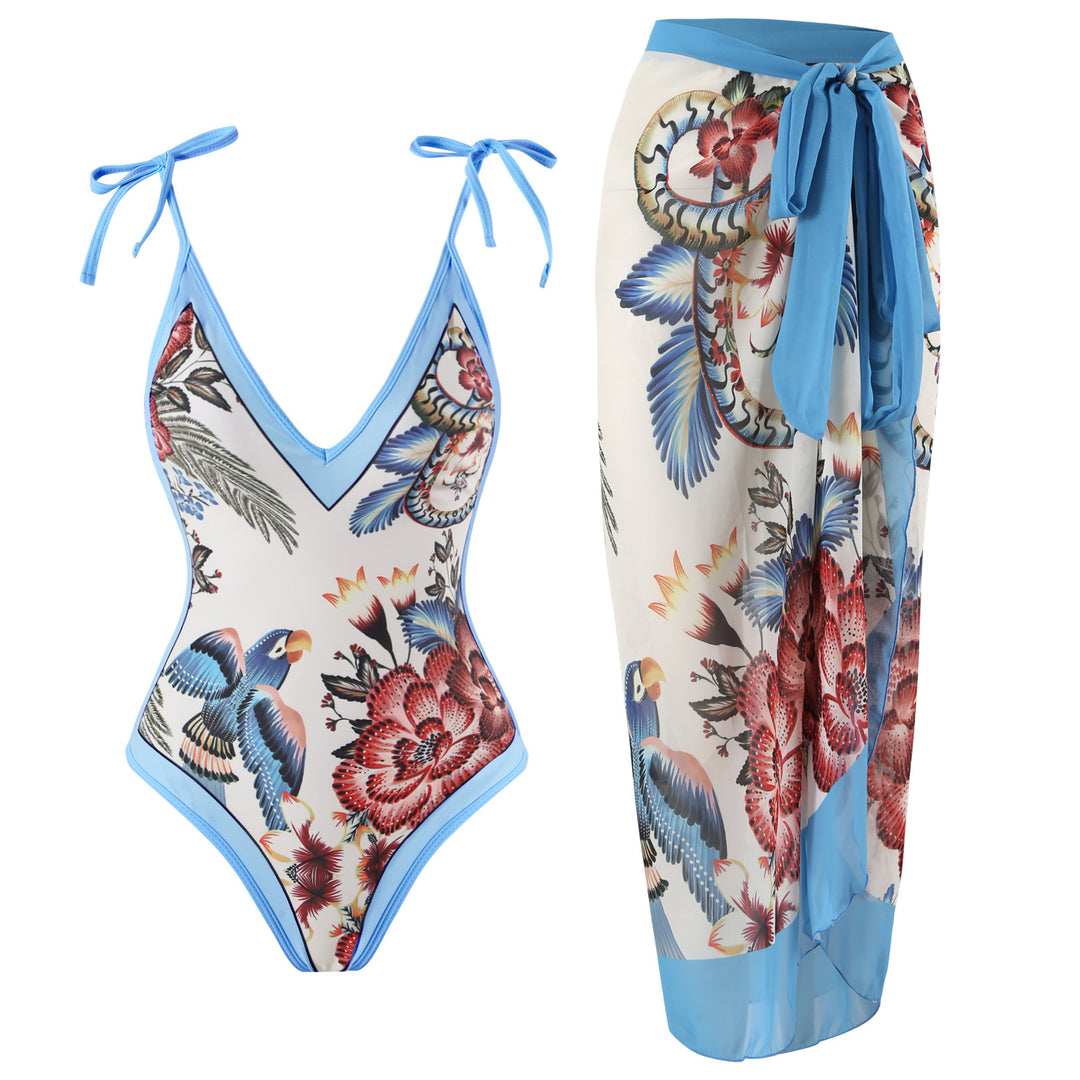 Dame heldragt badedragt med floralsk design og elegant omslagsskørt Stilla