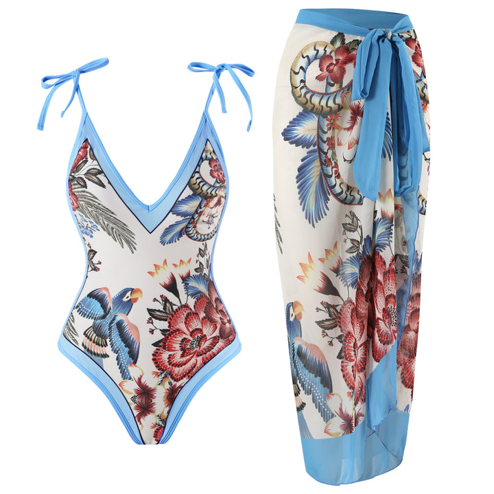 Dame heldragt badedragt med floralsk design og elegant omslagsskørt Stilla