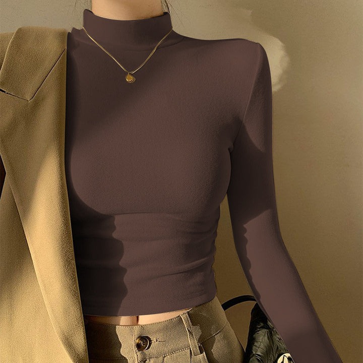 Kvinders langærmet crop top med høj krave og tætsiddende pasform