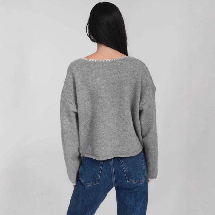 Kvinders hyggelige cropped sweater med asymmetrisk design og praktiske lommer Stilla