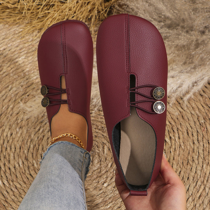 Dame Slip-On sko med moderigtigt knapdetalje og blødt overmateriale Stilla