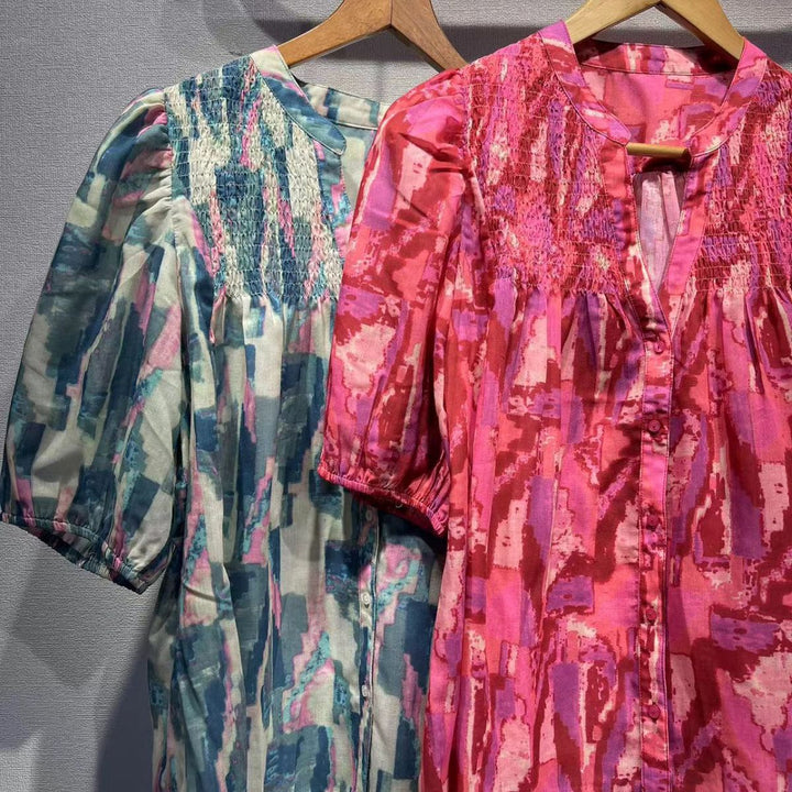Damebluse med voluminøse puffærmer og raffineret smockdesign Stilla