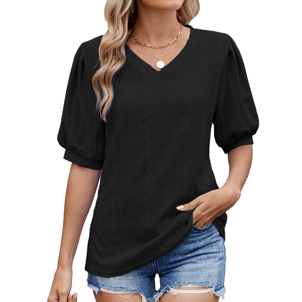 Damebluse med elegante puffærmer og fint hulmønster Skovae