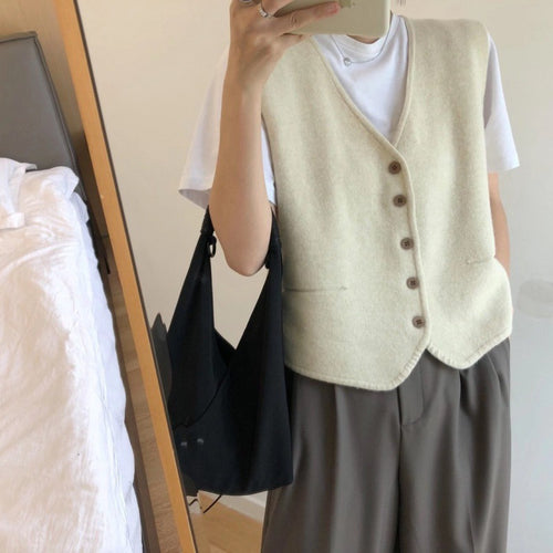 Damerne strikket vest med elegant knaplukning og fint materiale Stilla