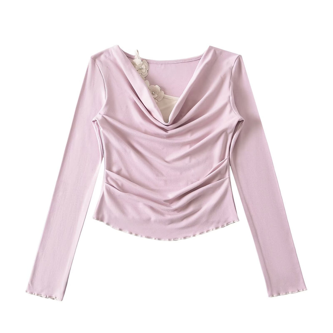 Dame elegant langærmet top med raffinerede draperingsdetaljer og blomsterakcent Stilla