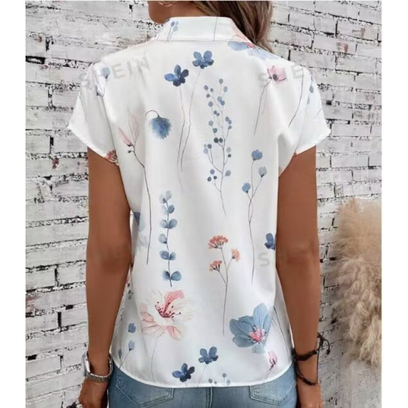 Damebluse med floraltryk og knapdetalje med korte ærmer Stilla
