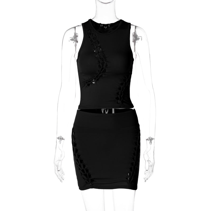 Dame Sæt bestående af sporty top og figursyet miniskørt med trendy cut-out-detaljer Stilla