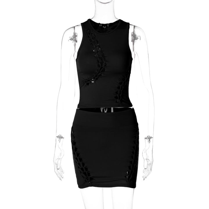 Dame Sæt bestående af sporty top og figursyet miniskørt med trendy cut-out-detaljer Stilla
