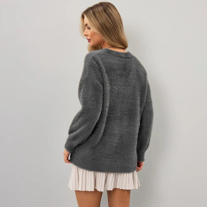Kvinders hyggelige cardigan med asymmetrisk snit og knaplukning Stilla