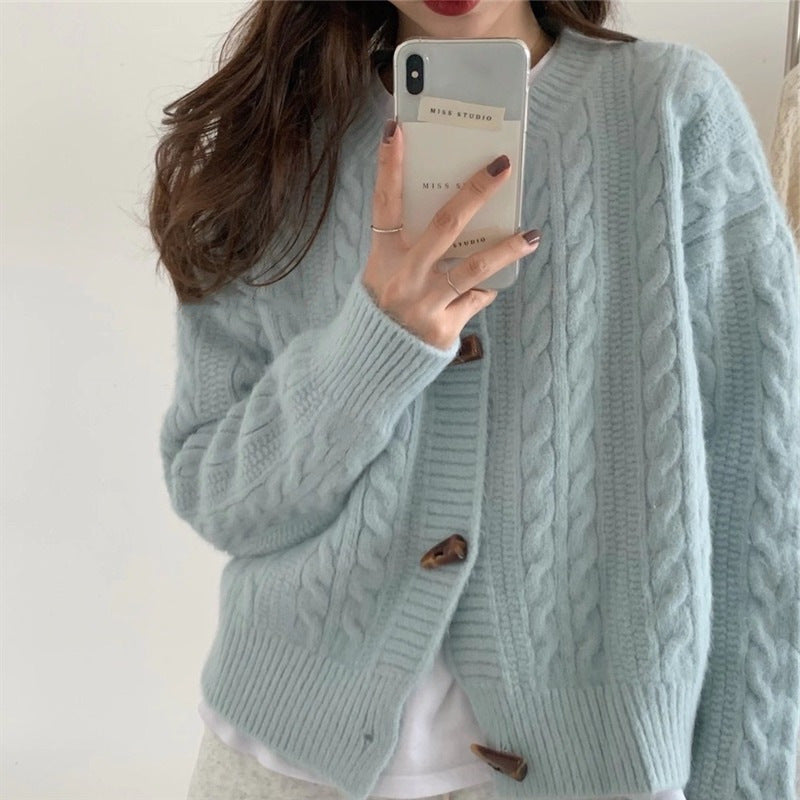 Kvinders cardigan med kabelstrik mønster og elegante knapdetaljer Stilla
