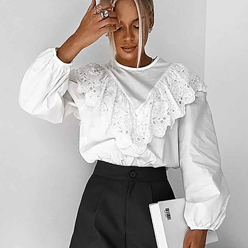 Damebluse med elegant spids og voluminøse ærmer Stilla