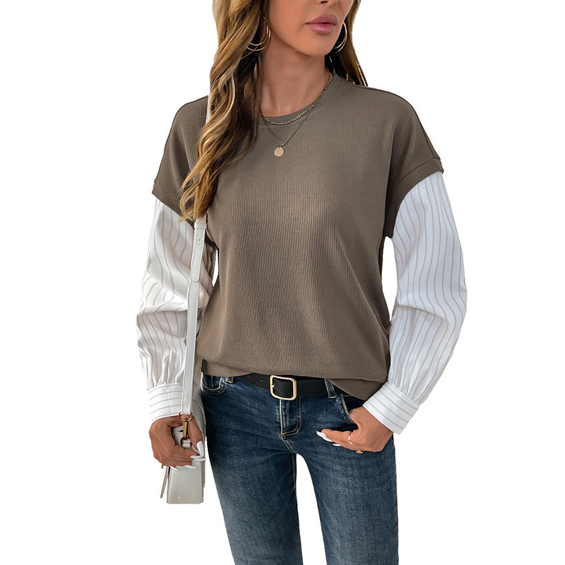 Dames fashionabel top med kreativ lagdelt look og elegante rullede ærmer Stilla