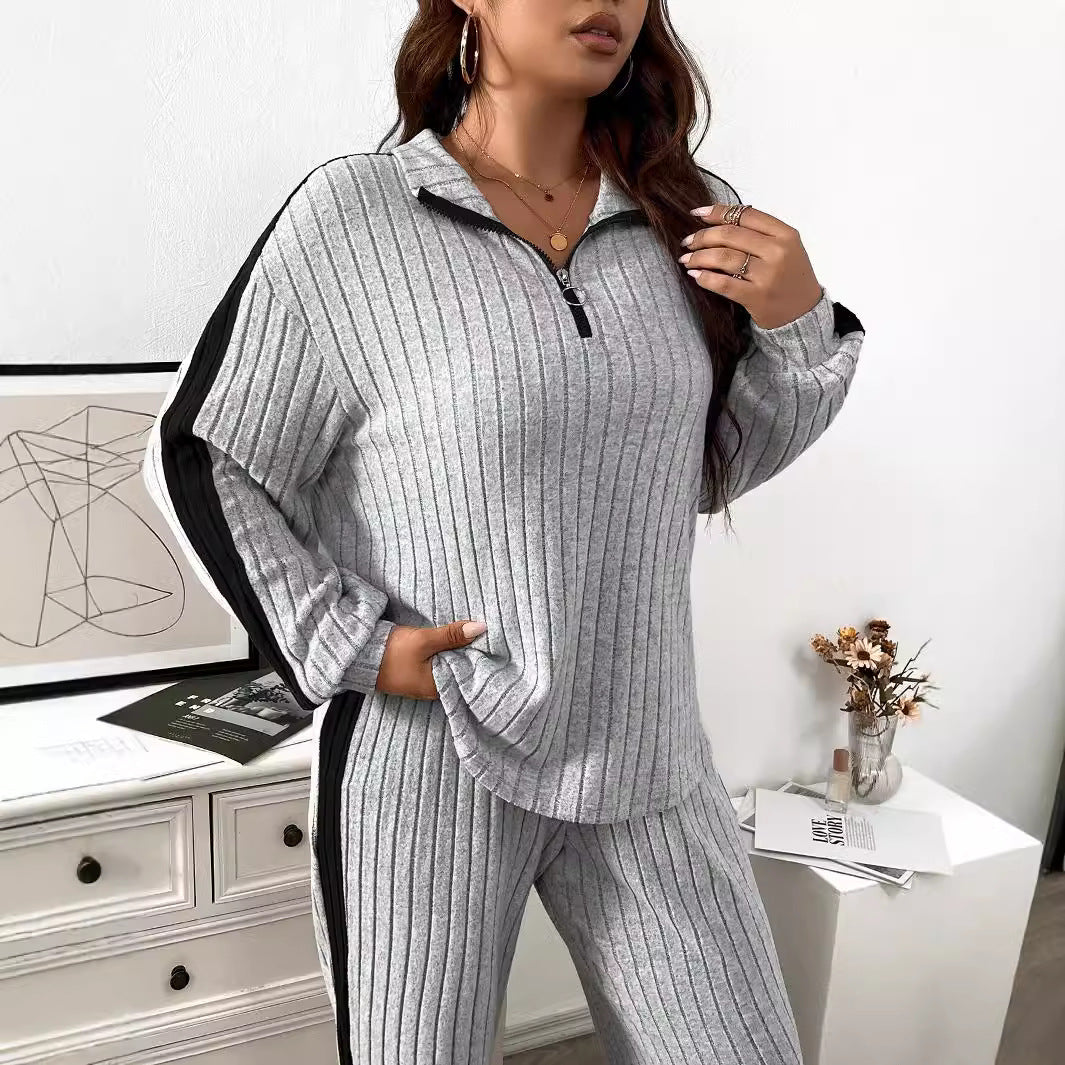 Dame elegant sportdragt med lynlås og stribet design Stilla
