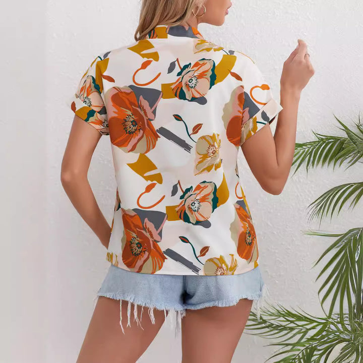 Dame kortærmet bluse med blomstret design Stilla