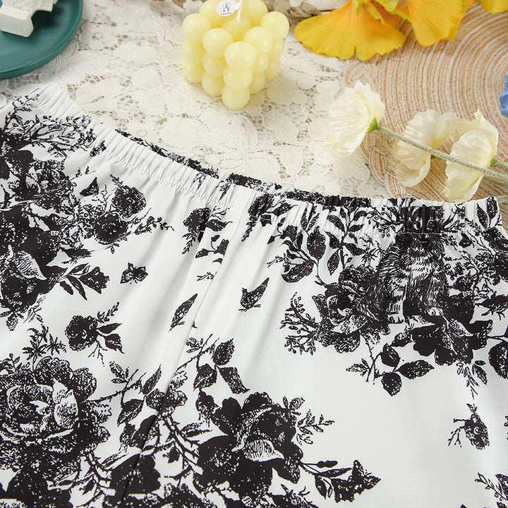 Dame satin pyjamasæt med blomsterdesign og elegante detaljer Stilla
