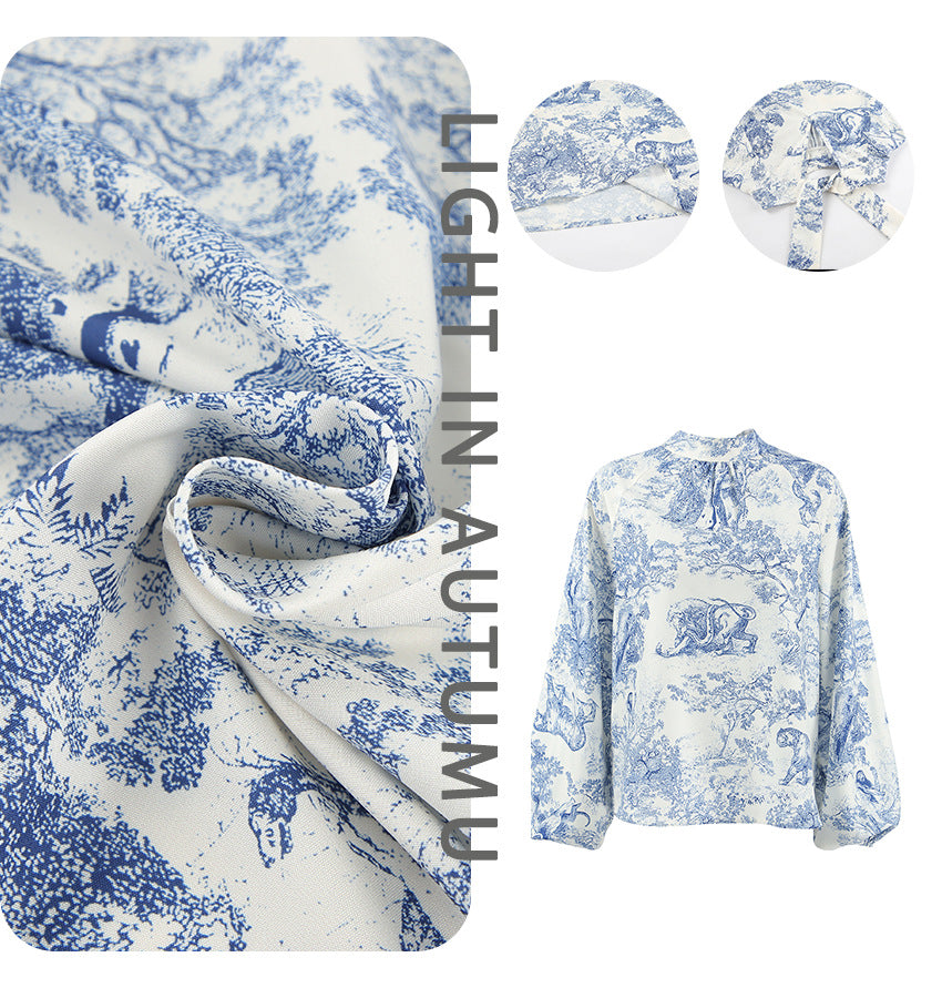 Damebluse med voluminøse ærmer og blomsterdesign Stilla
