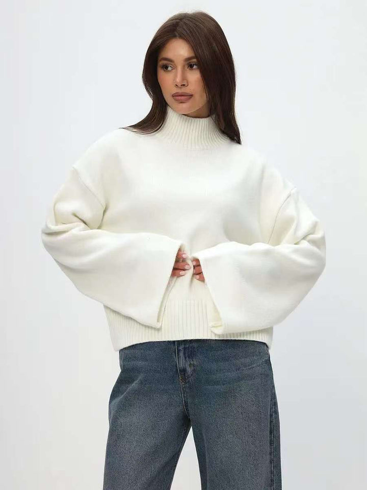 Kvindernes chunky strikket sweater med stående krave og voluminøse ærmer Stilla