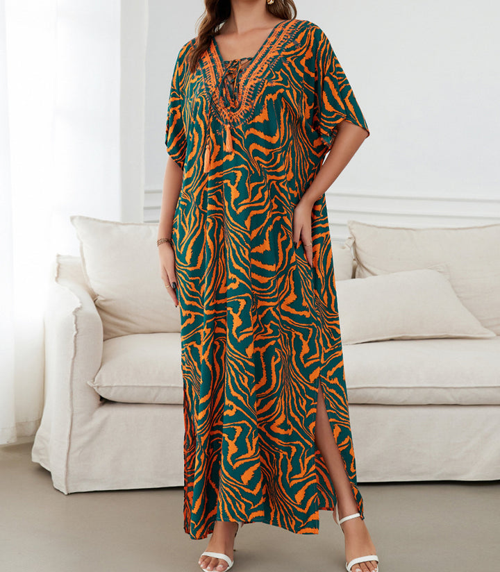 Dame strandkimono med legesygt blomsterdesign og sidelommer Stilla