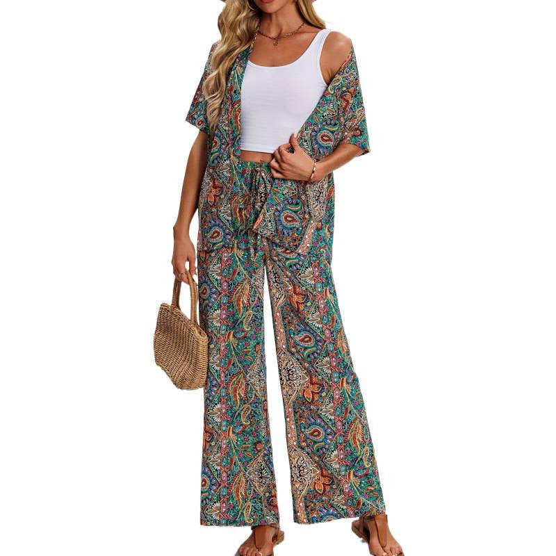 Dame kortærmet jumpsuit med flæse detaljer og bindebælte Skovae