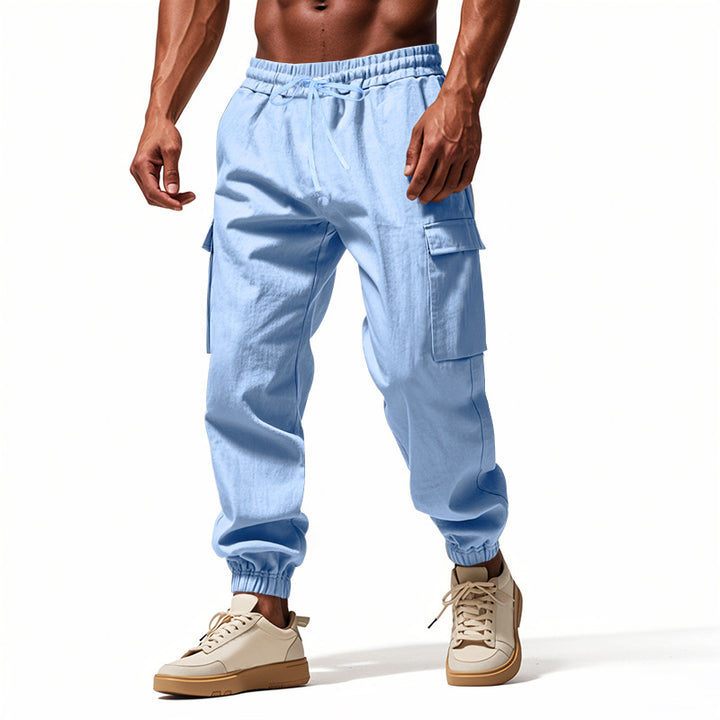 Herrer nan konisk skrånende joggere i utilitarisk stil med elastisk talje, snøre og klaplommer Skovae