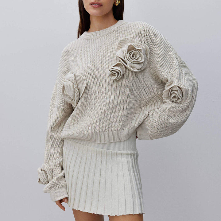 Dame strikpullover med innovative blomsterapplikationer Stilla