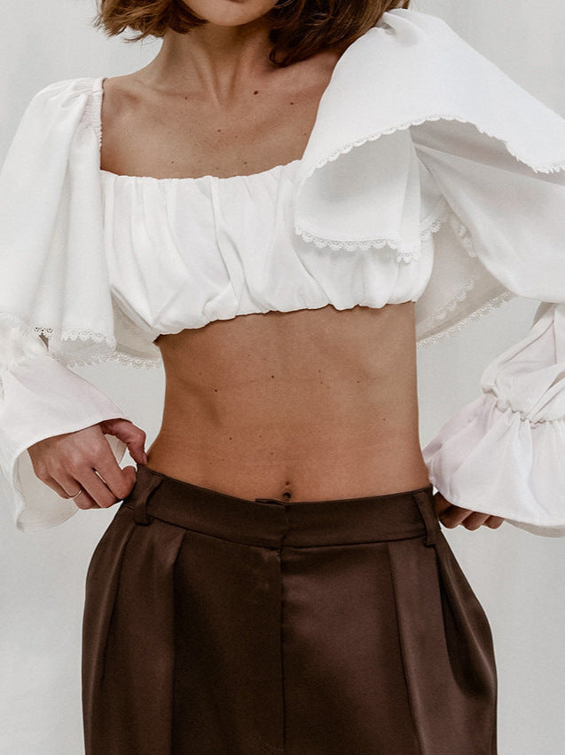 Dame volangstop med asymmetrisk design og elegante detaljer Stilla