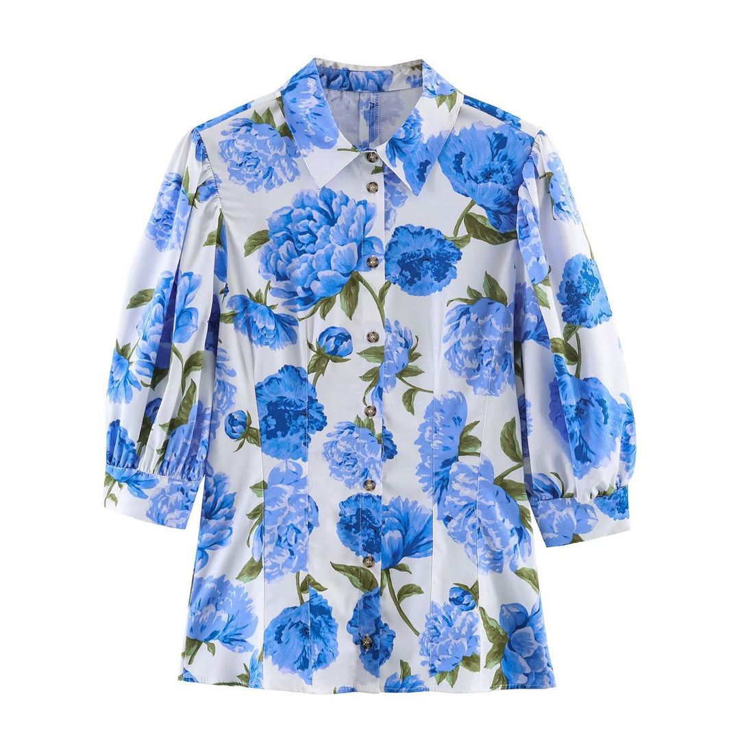 Damebluse med blomstermønster og elegante pufærmer Skovae