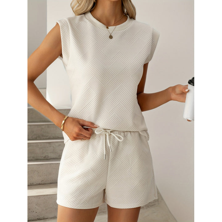 Dame kortærmet jumpsuit med flæse detaljer og bindebælte Skovae
