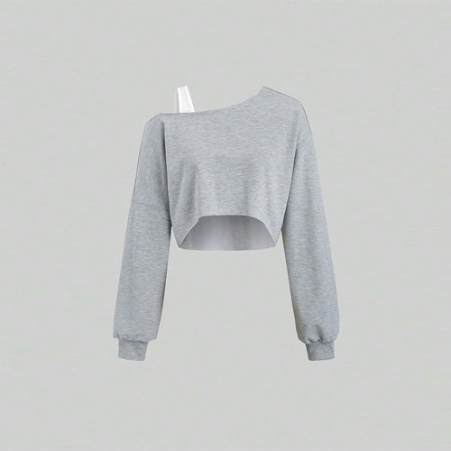 Kvinders cropped sweatshirt med asymmetrisk design og voluminøse ærmer Stilla