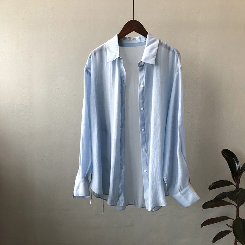 Dame løs bluse lavet af silkeblød materiale med elegante knapdetaljer og justerbare ærmer Stilla