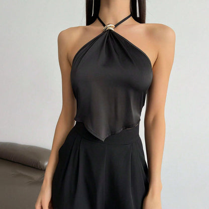 Dames elegant halterneck top med shiny stof og dekorativ knude Stilla