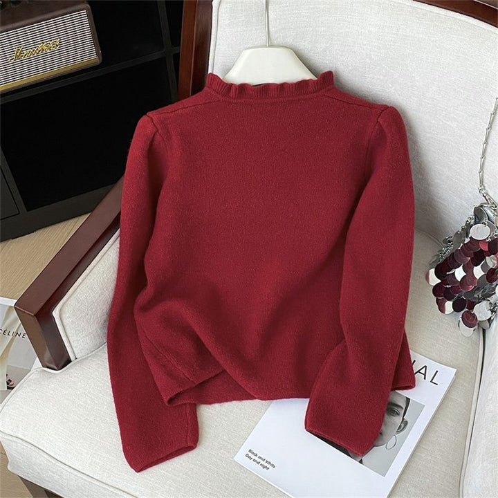 Damer elegant cardigan med feminine flæser og perleknapper Stilla
