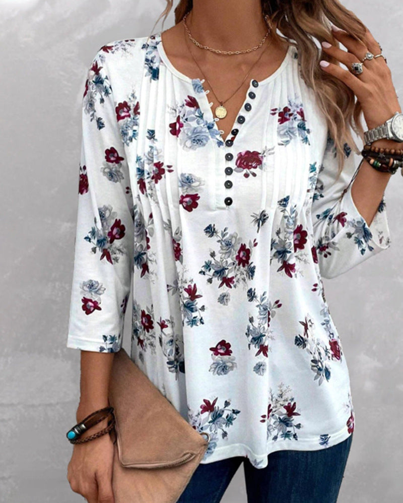Damebluse med florale accenter og knapper Stilla