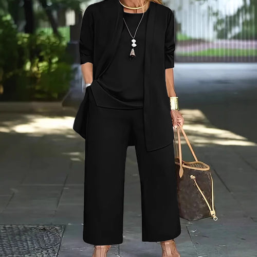 Dame Elegante og komfortabel todelt outfit med brede bukser og flydende top Stilla