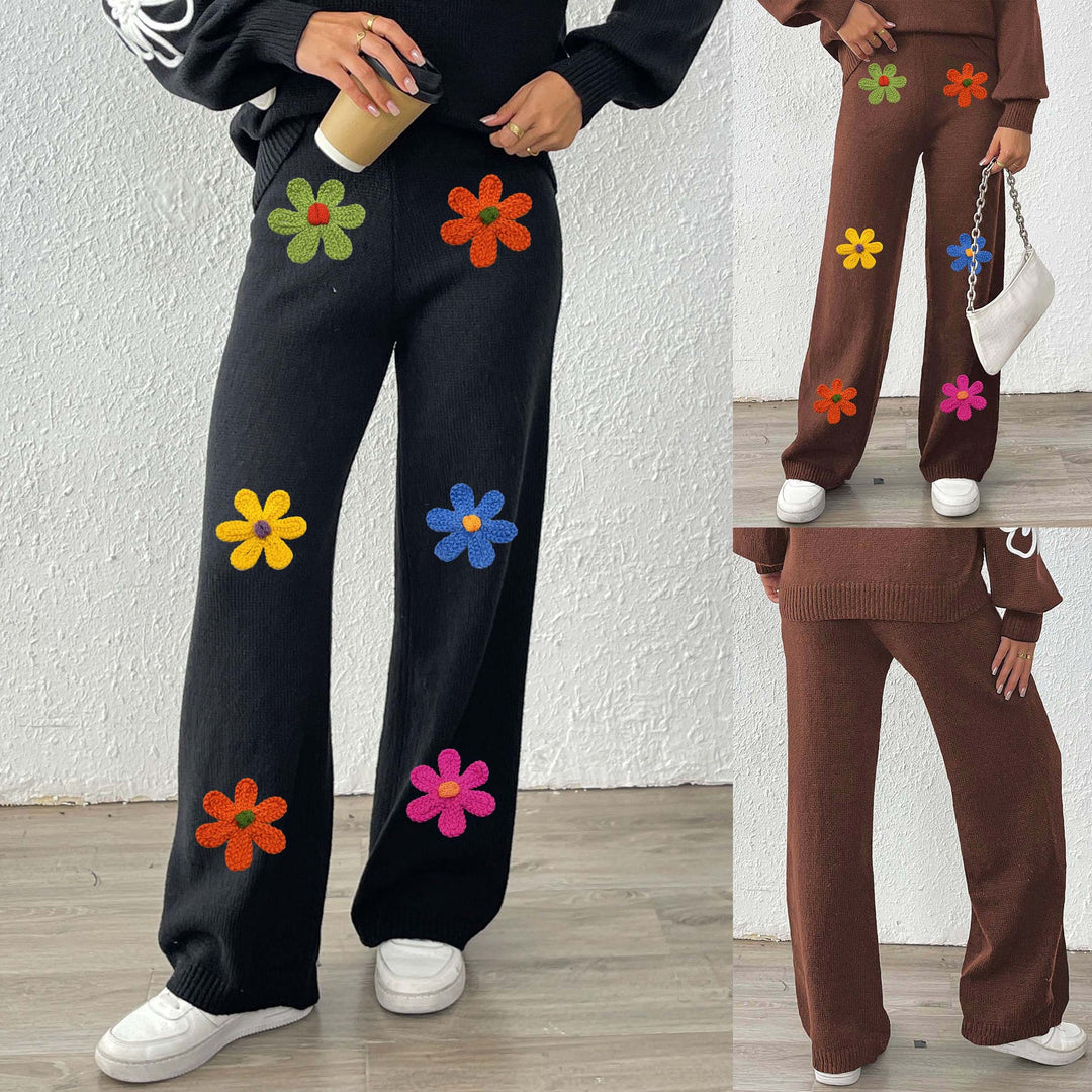 Dame afslappet strikbuks med farverige blomsterapplikationer Skovae