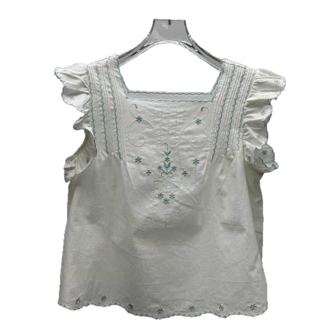 Damebluse med flæsedetaljer og elegant broderedesign Stilla