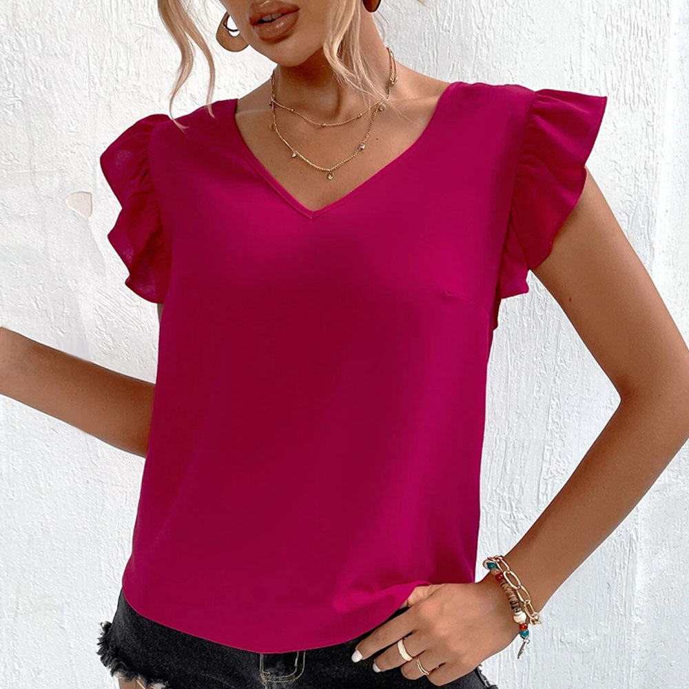 Damebluse med voluminøse flæsedetaljer og elegant V-hals Stilla
