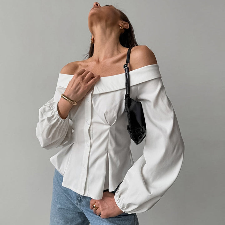 Damebluse med asymmetrisk udskæring og voluminøse ærmer Stilla