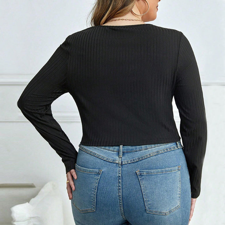 Dame tætsiddende langærmet body med moderne cut-out-design Stilla