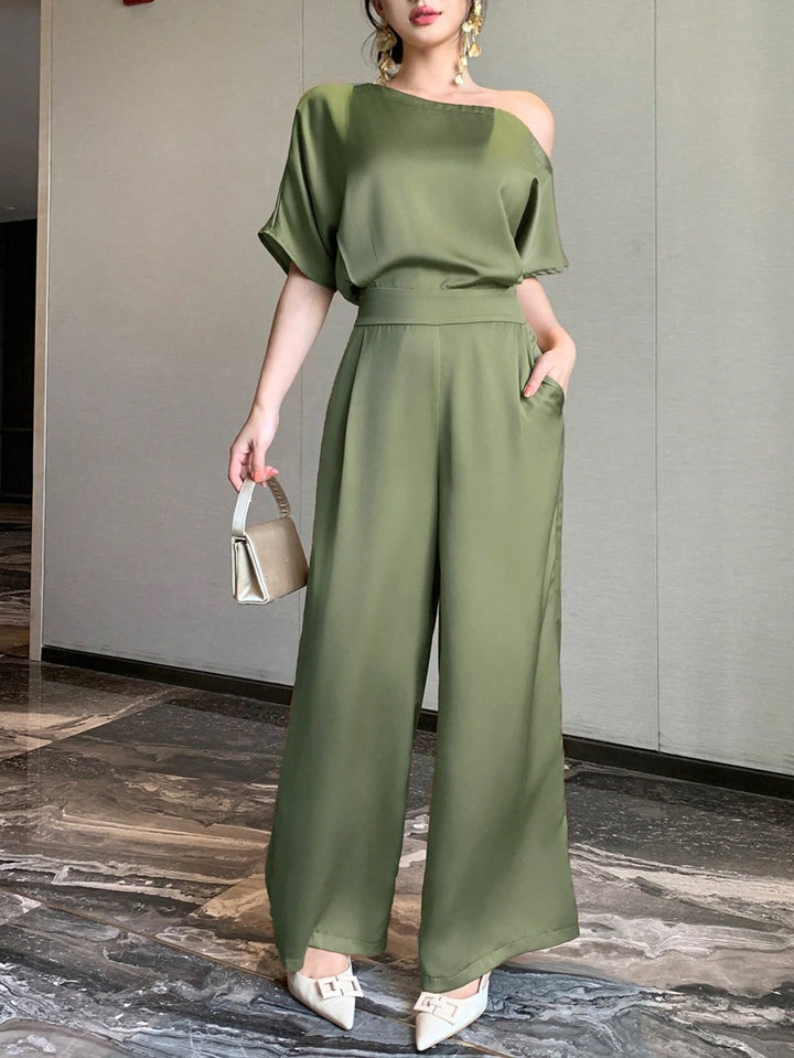 Dame Én skulder jumpsuit med bred ben og elegant snit Skovae