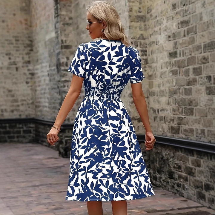 Dame strikkjole med floralt design og elastisk linning Stilla