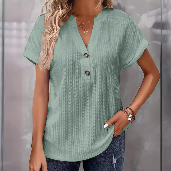 Damebluse med knapdetaljer og struktureret design Stilla
