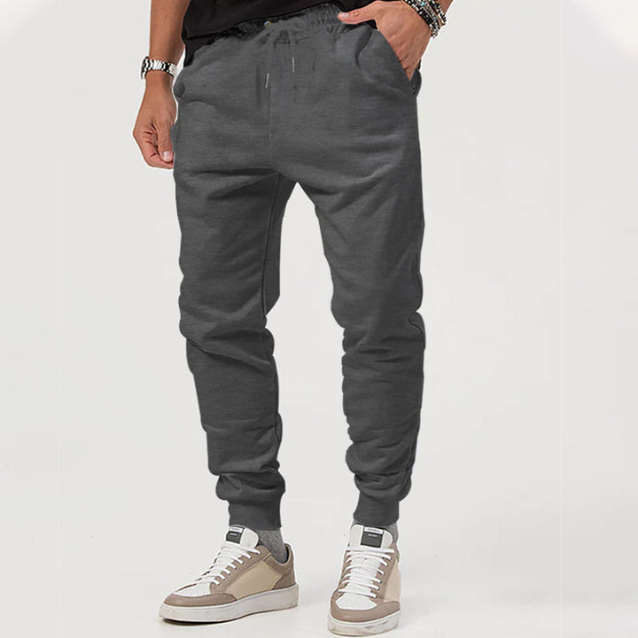 Herre nan Jersey-sweatpants i konisk snit med skjult snor og formstabile fodbånd Skovae